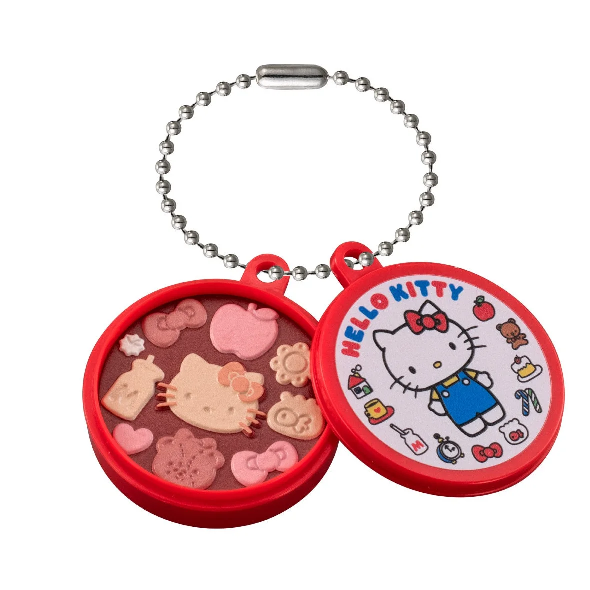 ハローキティの顔やリボン、リンゴなどの形をした可愛らしいアイテムが詰まった赤いコンパクト型のキーホルダー